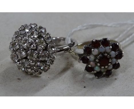 A garnet and opal dress ring and a Christian Dior dress ring, (2).