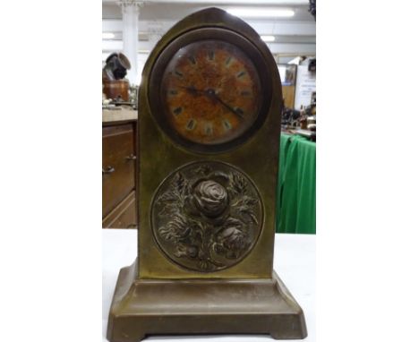 Brass cased lancet top mantel clock.