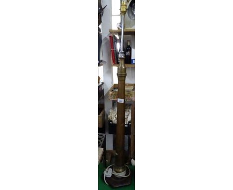 A large table lamp made out of a fireman's hose.