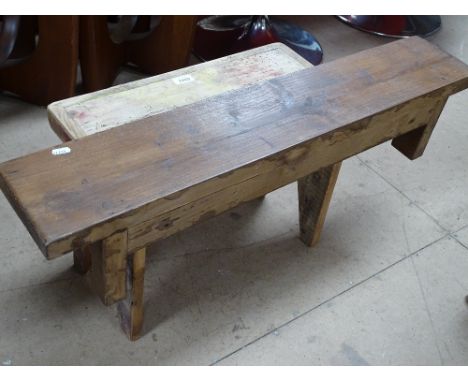 A small pine stool and a stained pine shelf.