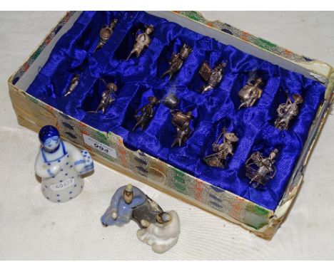 A set of 12 Chinese silver menu holders designed as artisans, and 2 oriental ceramic figures