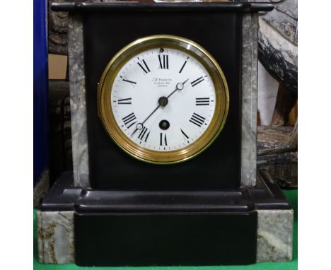 A slate cased mantel clock by J W Benson.