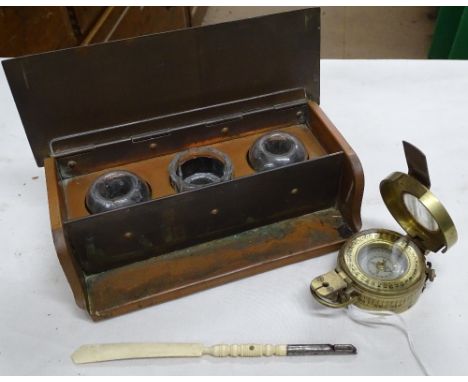 A brass compass by T Cook, London and a copper desk stand.