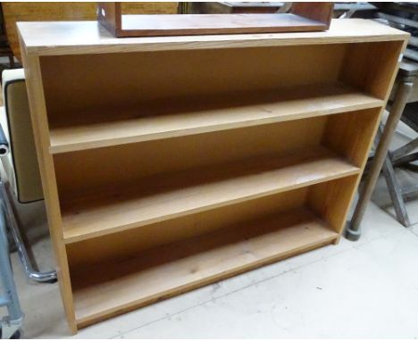 A pine open bookcase and a hanging mahogany shelf.