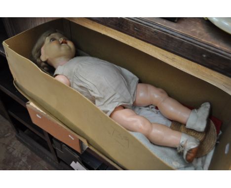 K & R German plastic doll with jointed limbs, and original clothes.
