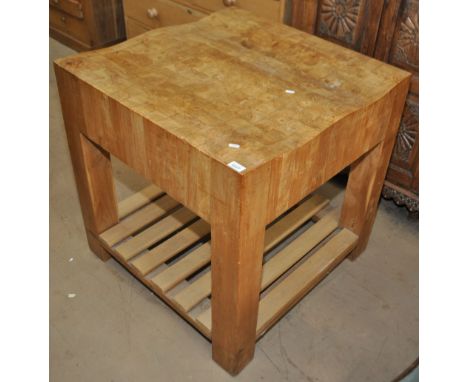 A modern square hardwood butcher's block, shaped top and shelf below, width 79cm, height 80cm