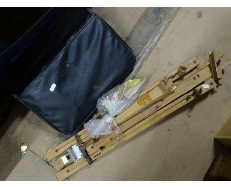 A case of artist's equipment and an easel.