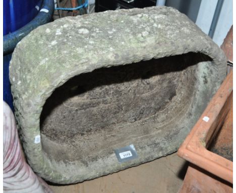 A weathered concrete garden trough, height 20cm, length 55cm, depth 46cm.