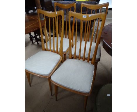 A set of 4 Vintage continental beech kitchen stick back chairs, with rexine upholstered seats and tapered legs.