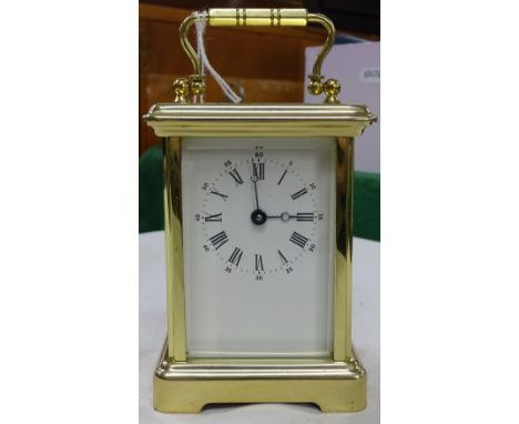 A brass cased carriage clock.