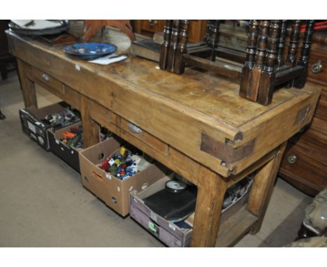 A large polished butcher's block, with 2 drawers and shelf under, length 202cm, height 90cm, depth 72cm.