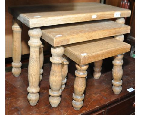 A light oak rectangular nest of 3 occasional tables.
