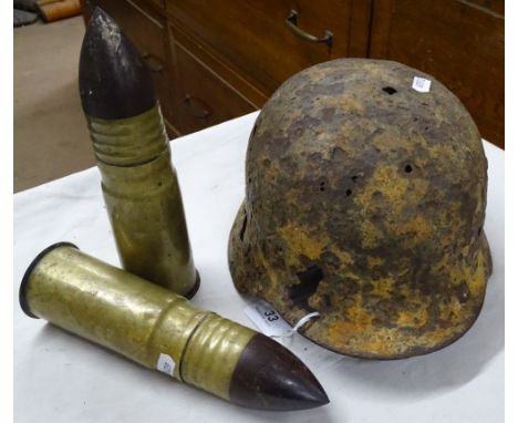 A tin helmet and 2 cannon shells.