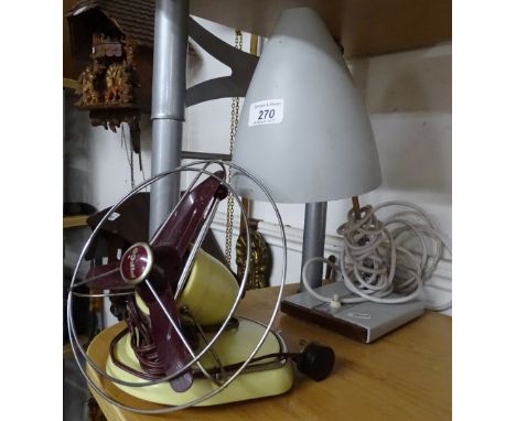 An adjustable table lamp and a Pifco fan.