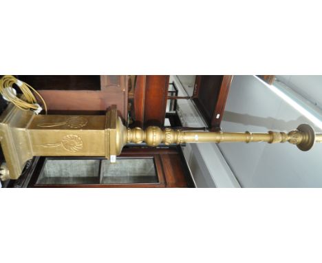 An Edwardian turned and carved giltwood standard lamp.