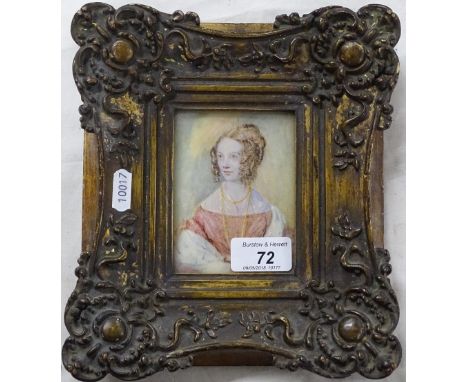 A gilt framed portrait of a lady.