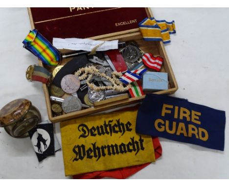 Military medals, military cloth badges, an owl, necklace, alarm clock, etc.