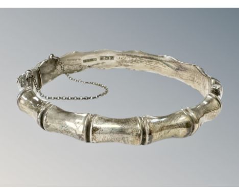 A silver bamboo-effect bangle