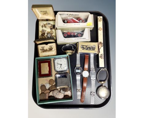 A tray of die cast models, wrist watches, unicorn lighter etc 