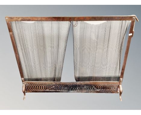 A Victorian copper and mesh fire screen 