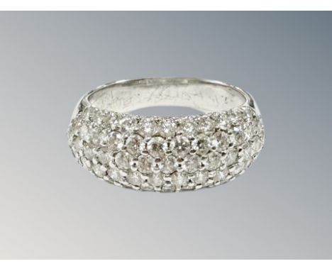 An 18ct white gold diamond five row fifty-nine stone diamond cluster ring, size K, 4.9g. CONDITION REPORT: Stones are white a