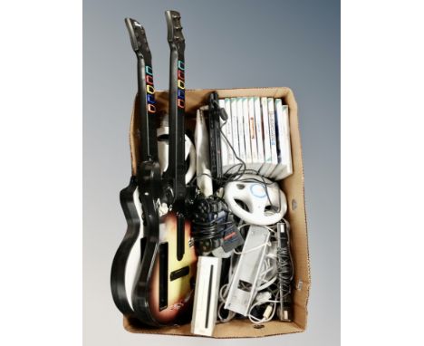 A box of Nintendo Wii console games, leads and accessories, guitars, PS2 slim