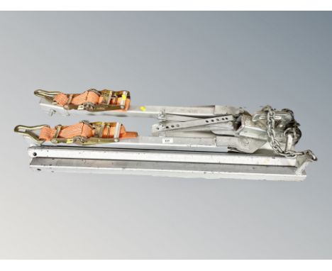 A trailer hitch with ratchet straps 