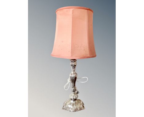 An ornate silver plated table lamp with shade, base 41 cm