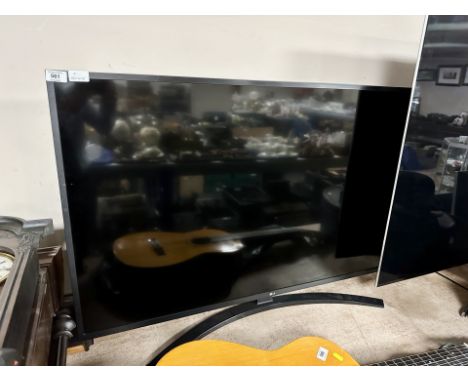 An LG model 50UM 7450PLA LCD TV with lead and remote 