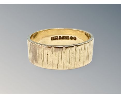 A 9ct gold band ring, size M CONDITION REPORT: 4.1g