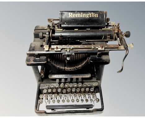 An antique Remington typewriter with cover 