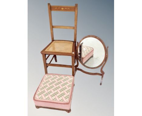 An Edwardian inlaid mahogany bedroom chair together with a swing dressing table mirror on stand and footstool on bun feet 