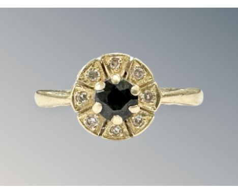 An 18ct gold sapphire and diamond cluster ring, size M CONDITION REPORT: 3.8g