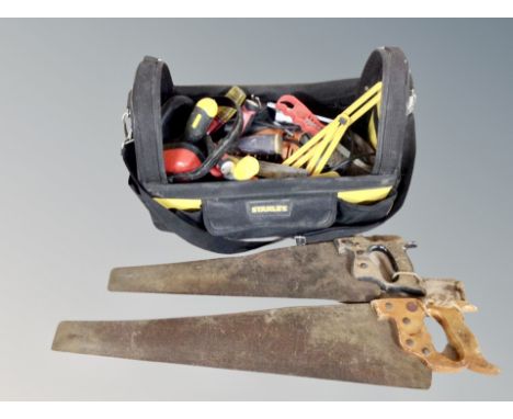 A Stanley fabric tool bag/caddy containing hand tools and saws 