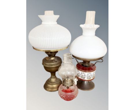A brass Duplex vintage oil lamp with chimney and shade and two further oil lamps  CONDITION REPORT: One converted 