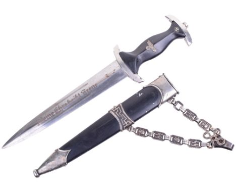 WW2 German SS Officers Chained Dress Dagger, black ebony handle having inserted eagle and enamel SS runes. Scabbard is fitted