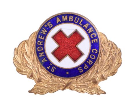 St Andrews Ambulance Corps Officers Cap Badge, gilt and enamel cap badge with two lug fittings on the reverse. 