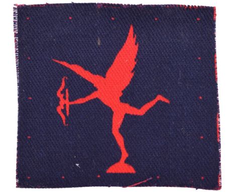 Printed 97th Army Group Royal Artillery (A.G.R.A) Formation Sign, figure of Eros in red on dark blue square. Tape residue on 