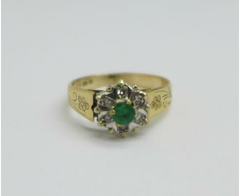 A 9ct gold, emerald and six diamond cluster ring, 2.4g, L 