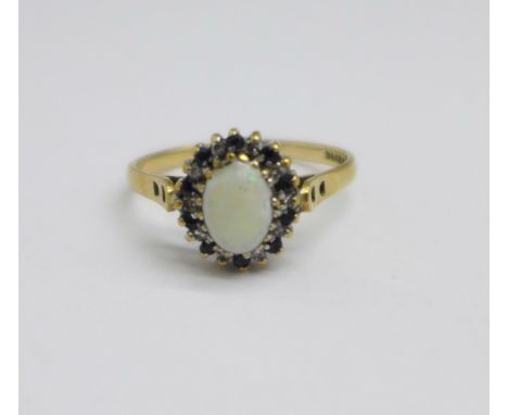 A 9ct gold, opal, ten diamond and ten sapphire cluster ring, 1.8g, O, opal a/f 