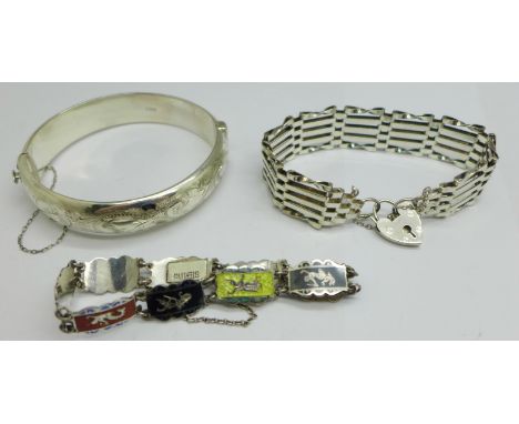 A vintage silver gate bracelet, London 1978, a silver bangle, Birmingham 1967, (one shallow dent on the front), and a Siam st