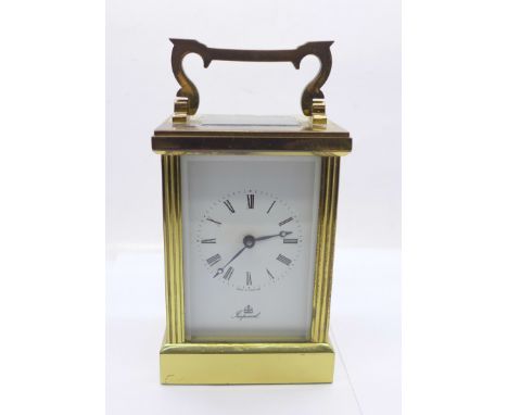 A brass and four sided glass Imperial carriage clock, made in England 