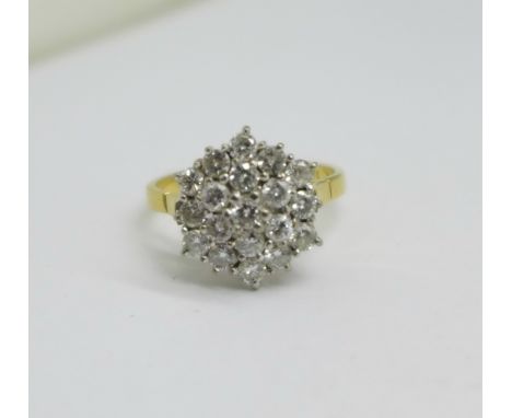 An 18ct gold and diamond cluster ring, 4.3g, N, set with nineteen diamonds, approximately 1carat diamond weight 