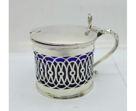 A pierced silver mustard with blue glass liner, small chips on rim of liner, Sheffield 1908, 77g 