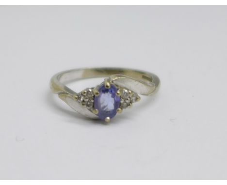 An 18ct white gold, diamond and tanzanite ring, 3.4g, O 