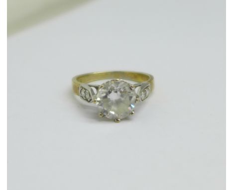 A 9ct gold, white stone solitaire ring with white stone set shoulders, 2.7g, K 