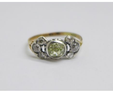 A Georgian seven stone diamond ring with gold shank and silver settings, centre stone approximately 0.75carat weight, 2.4g, Q