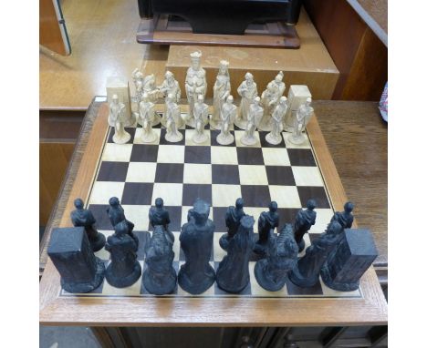 A Camelot Reformation chess set and board 