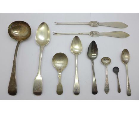 A collection of silver spoons including a Victorian ladle by George Adams and other 19th Century, and a pair of silver lobste