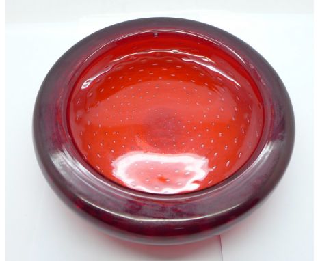 A Whitefriars ruby glass dish with controlled bubble decoration 